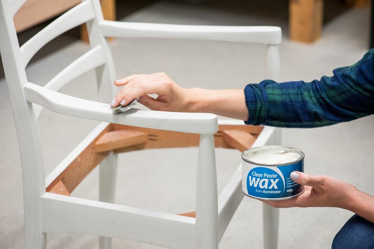 Applying Axminster wax to the chair